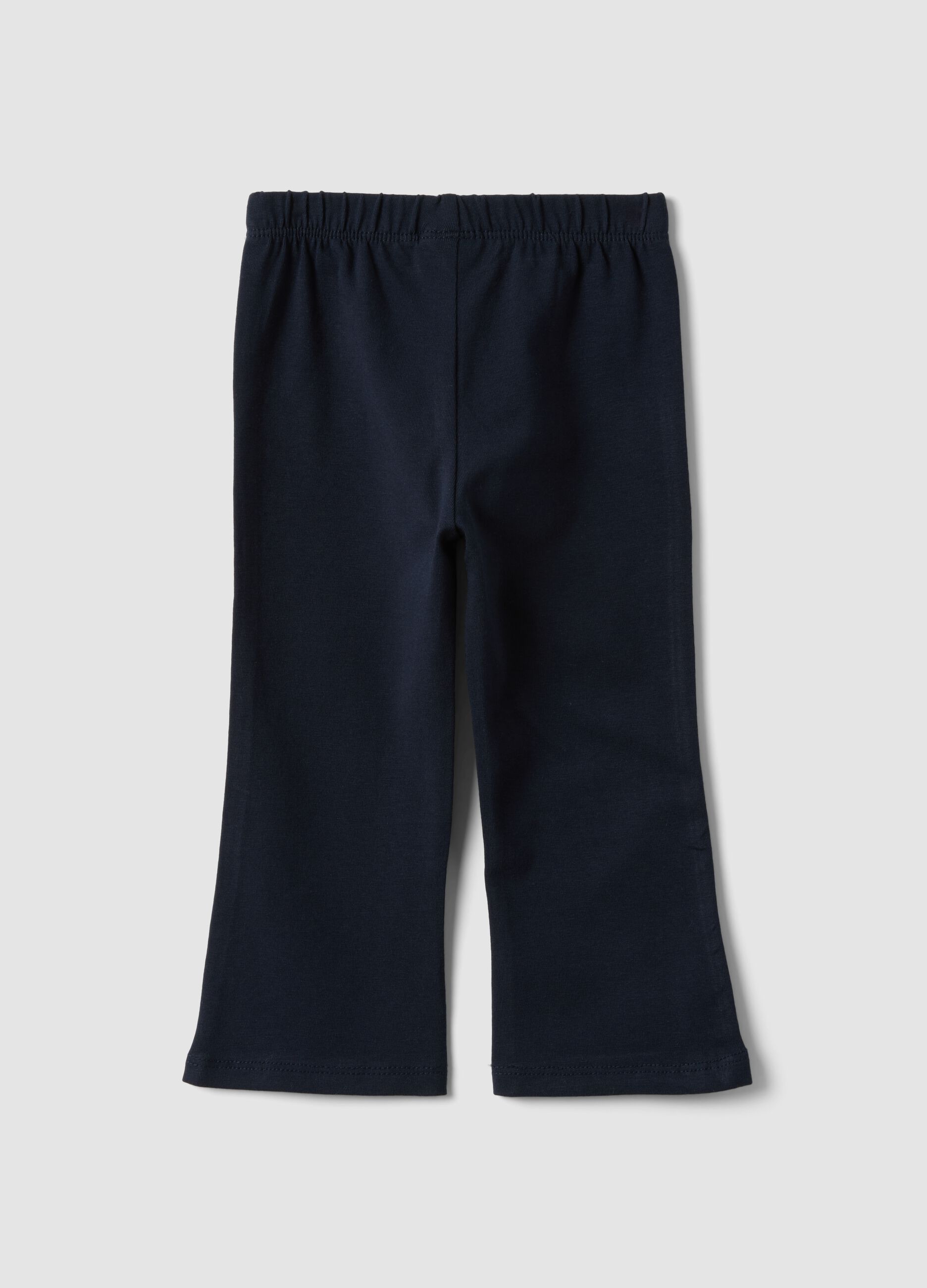 Blue flared leggings in stretchy organic cotton with heart detail for baby girl