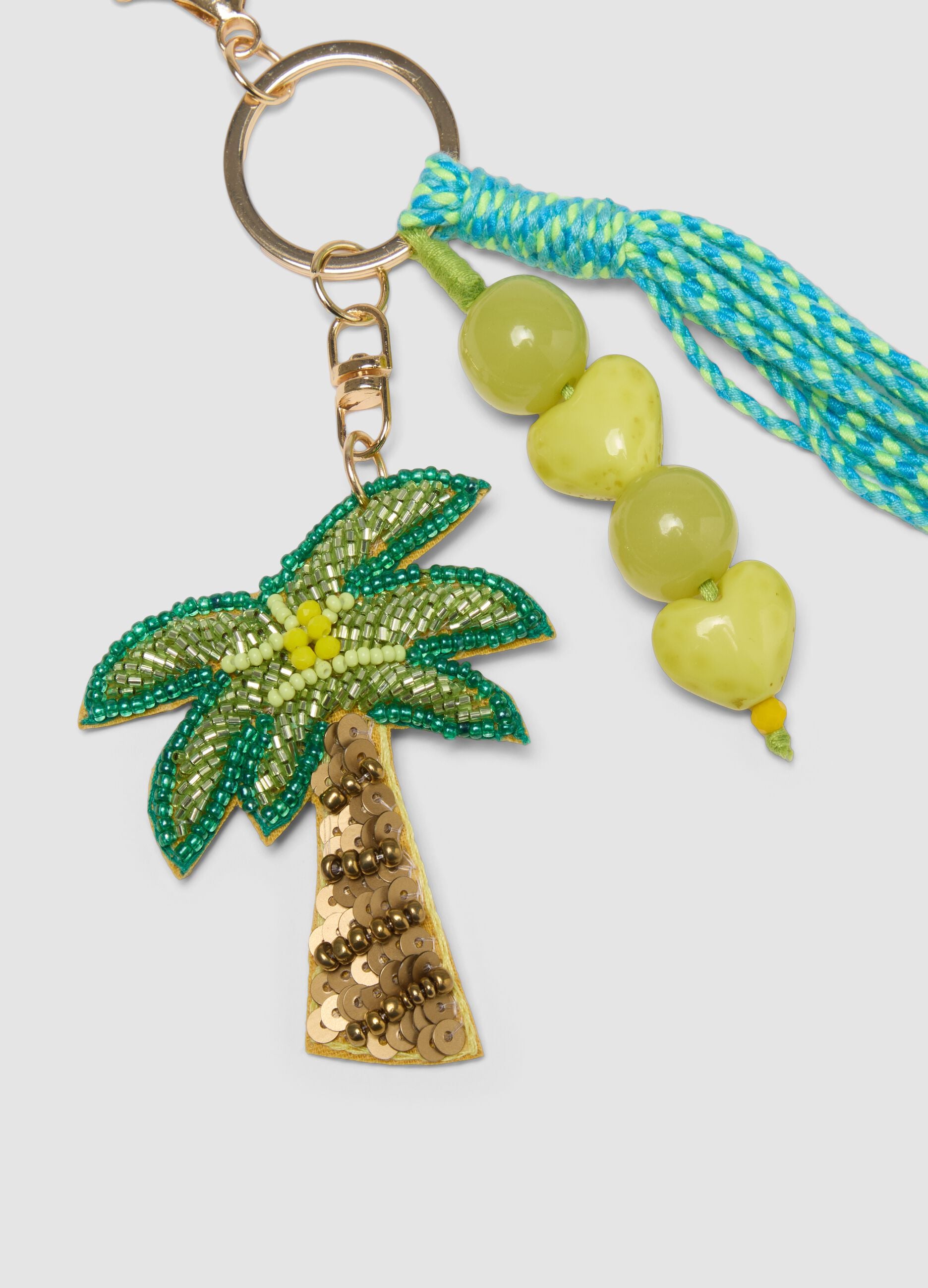 Portachiavi multicolor con nappina e charm tropicali