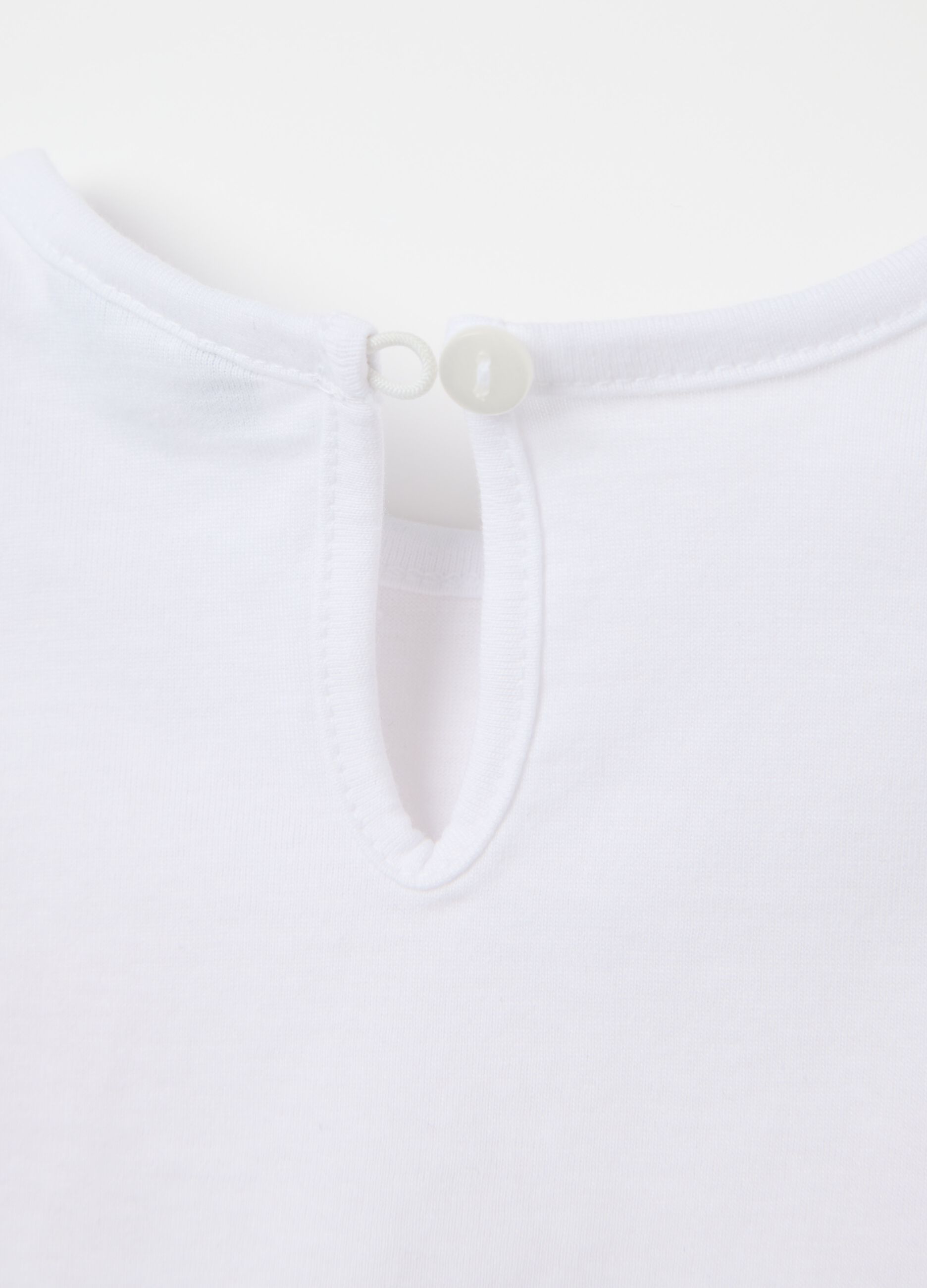White T-shirt in cotton with print and flounce