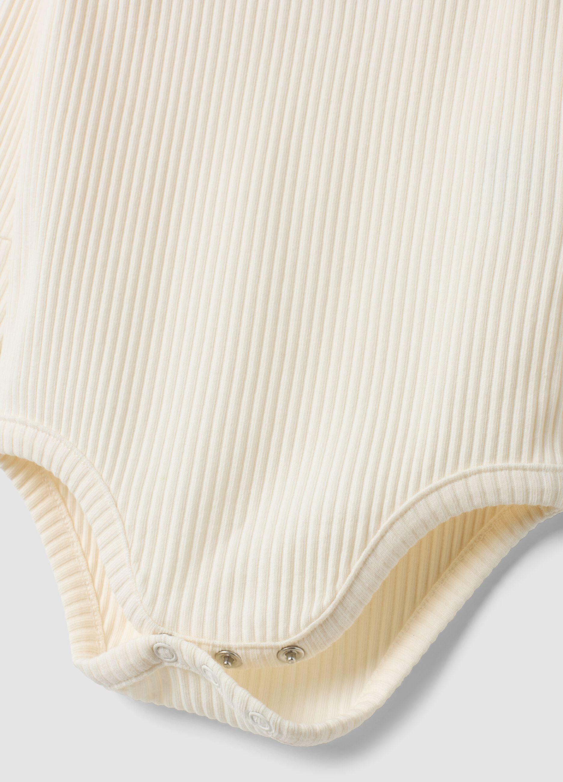 White ribbed organic cotton Disney bodysuit with ruffles and 101 Dalmatians print for baby girl