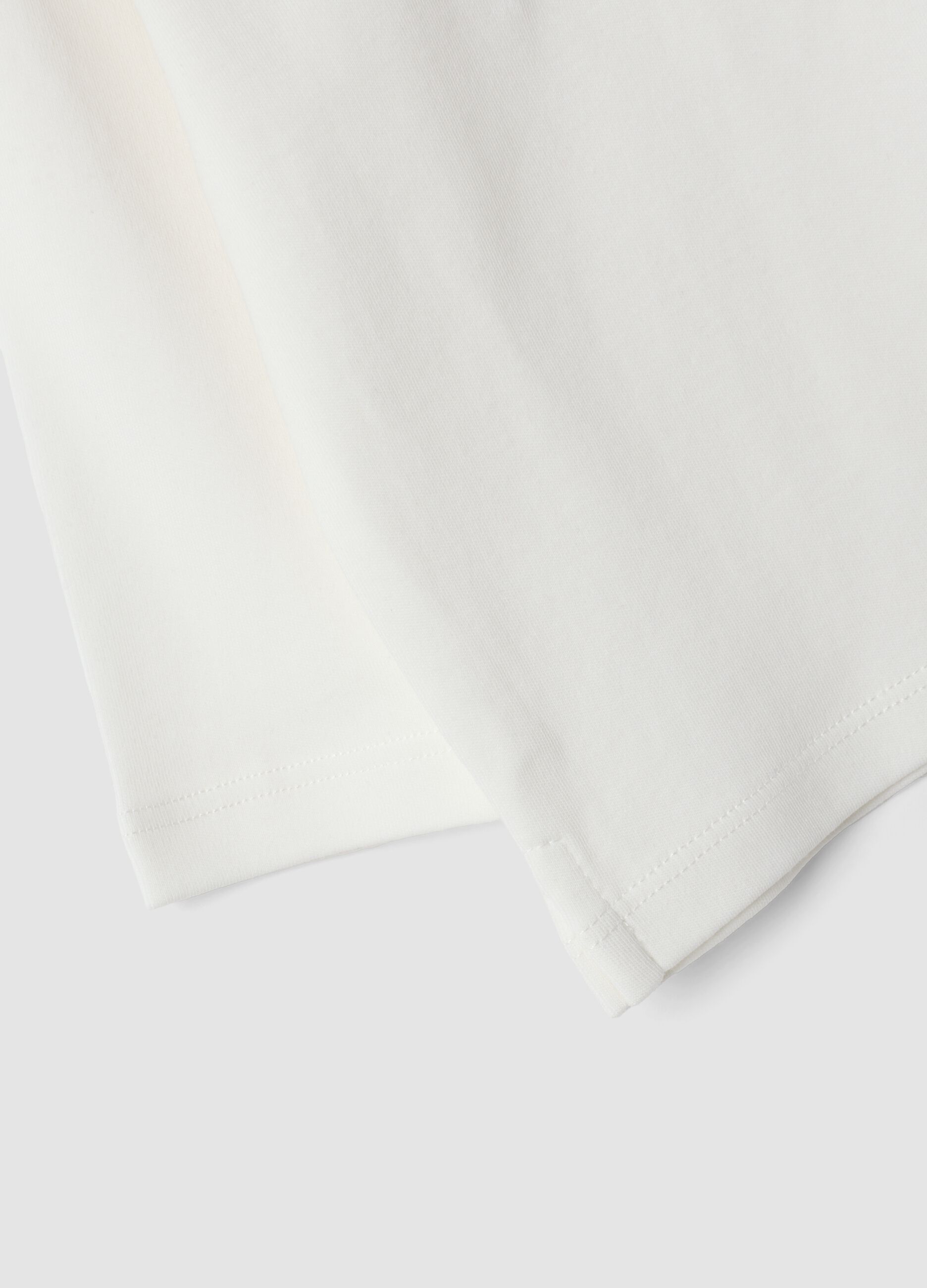 White long-sleeved polo shirt in pure organic cotton for baby boy