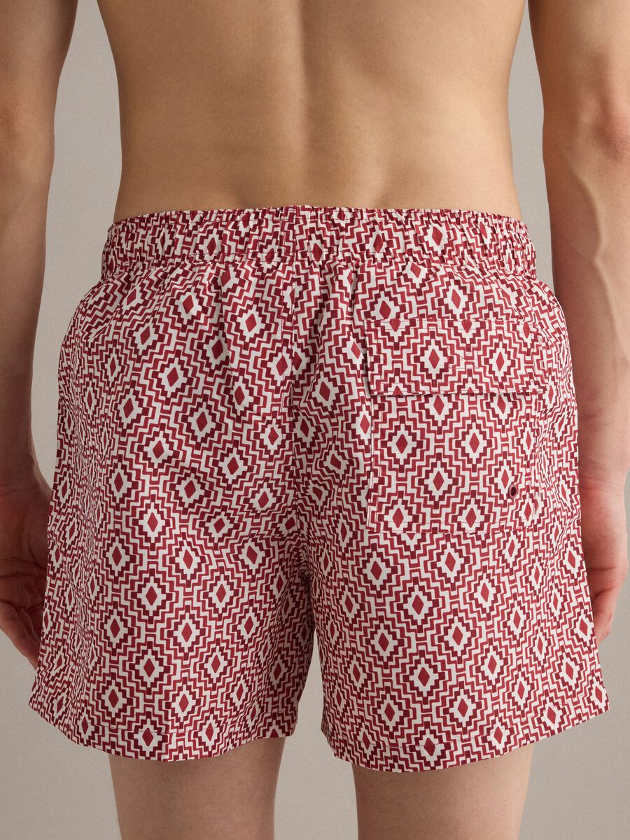 Red swim shorts with geometric print_3