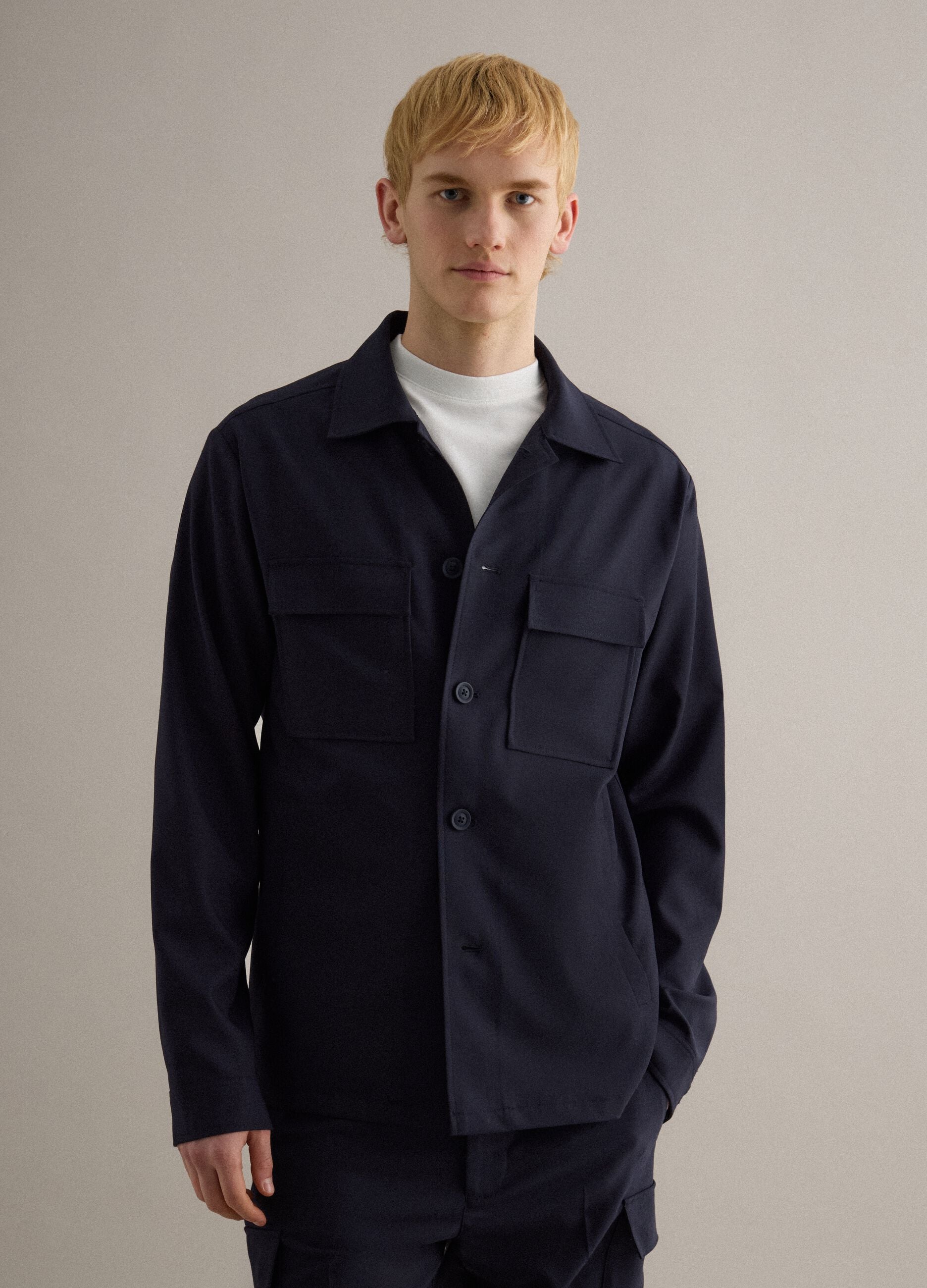 Light blue regular fit jacket with buttons and front pockets