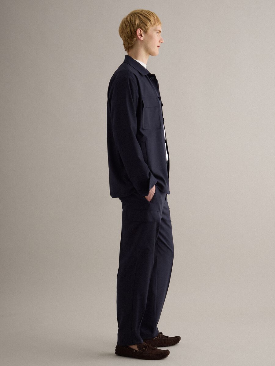 Light blue regular fit jacket with buttons and front pockets_1