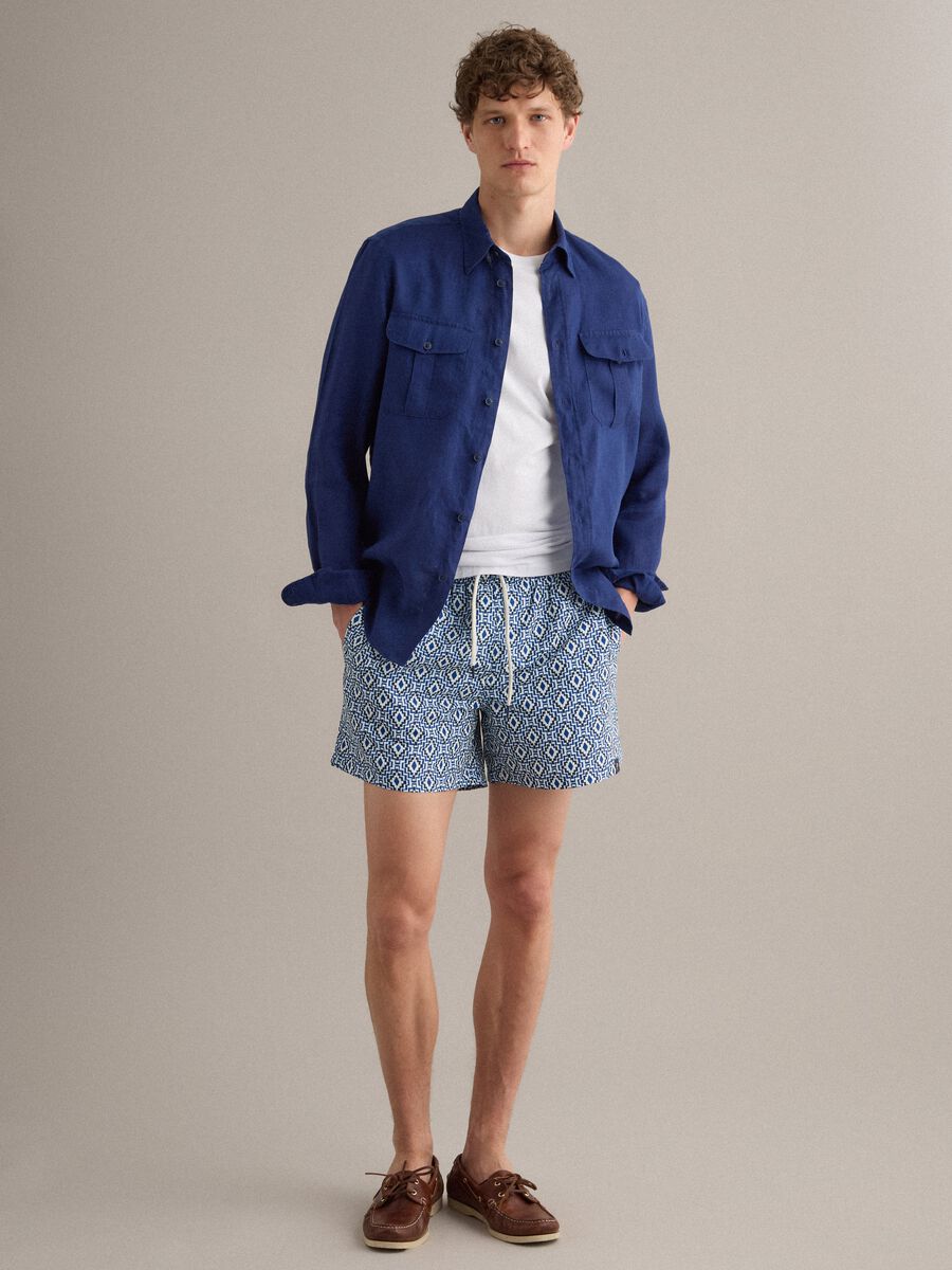 Blue swim shorts with geometric print_0
