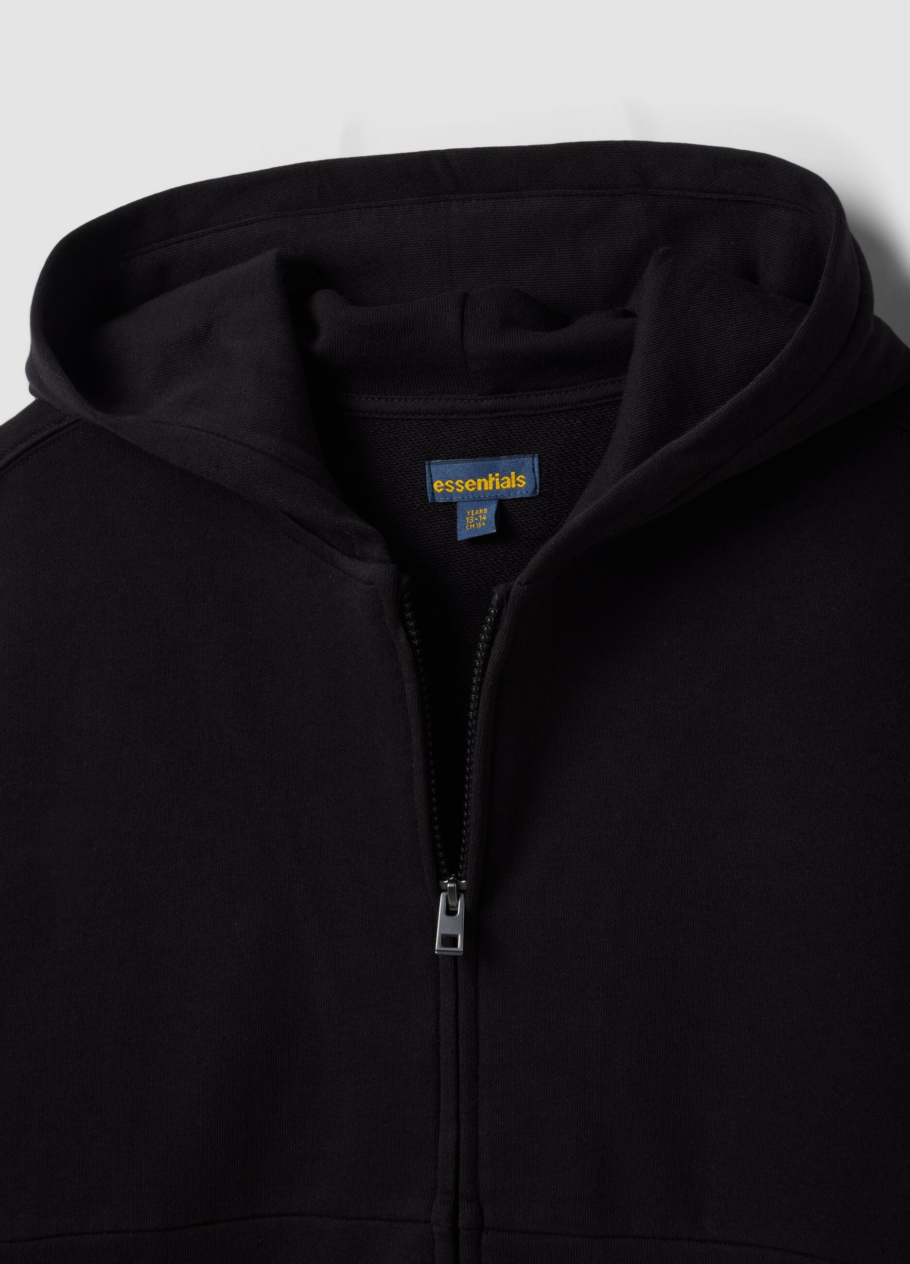 Black organic cotton zip-up hoodie for boys in a relaxed fit