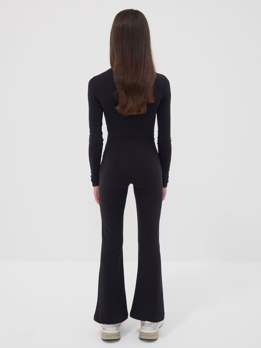Black flared stretch organic cotton trousers for girls_2
