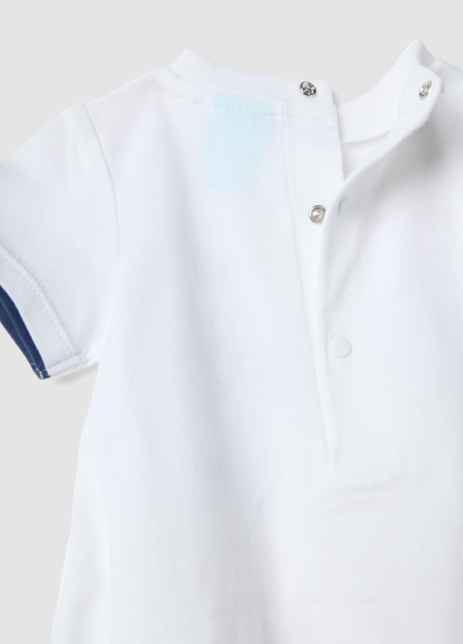 White pure cotton infant onesie featuring Mickey Mouse
