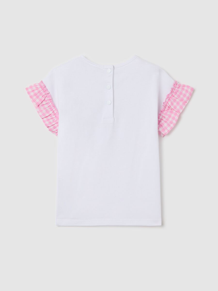 T-shirt bianca con volant e applicazione cupcake_1