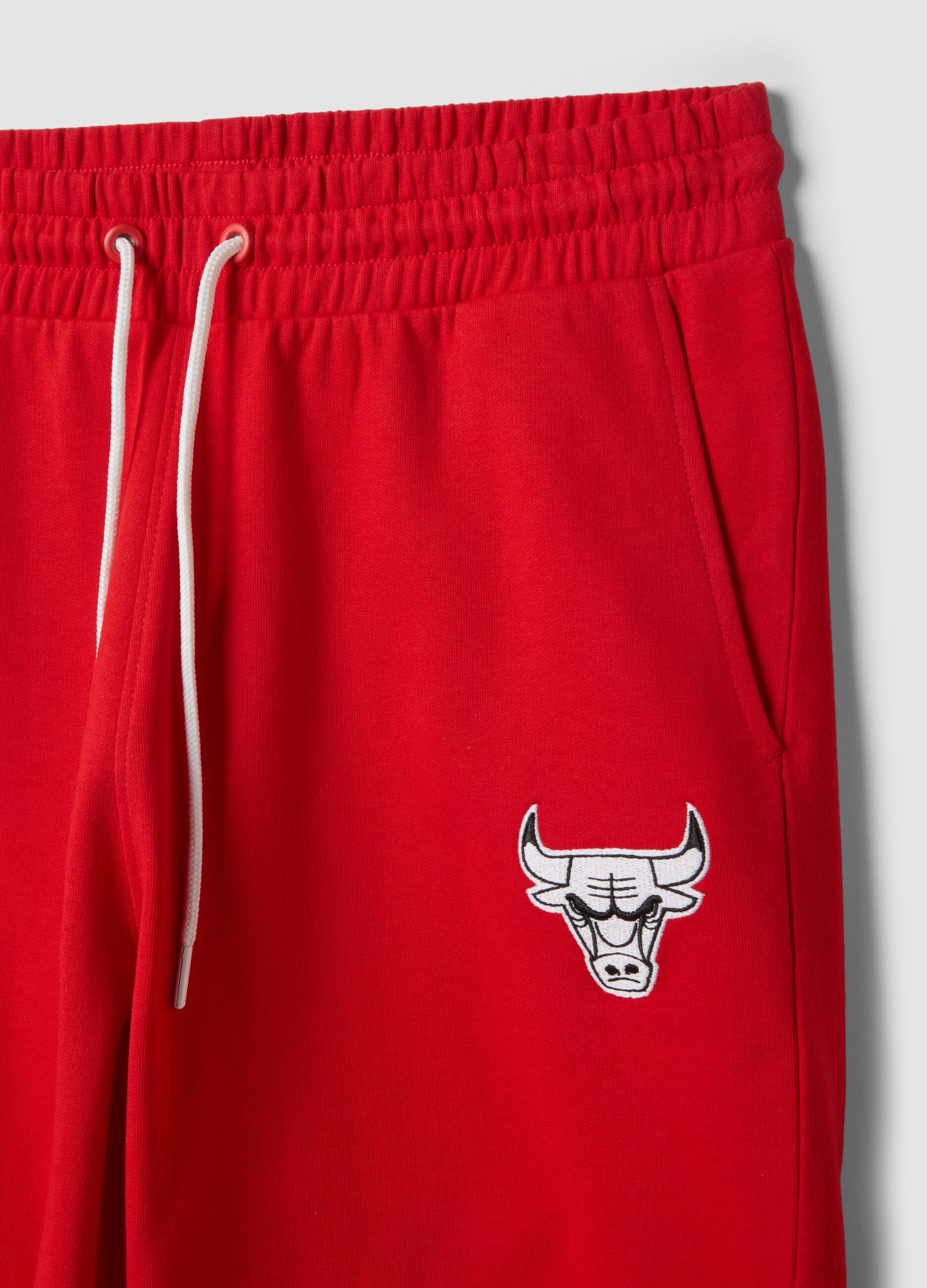 Red cotton-blend sports shorts with Chicago Bulls logo