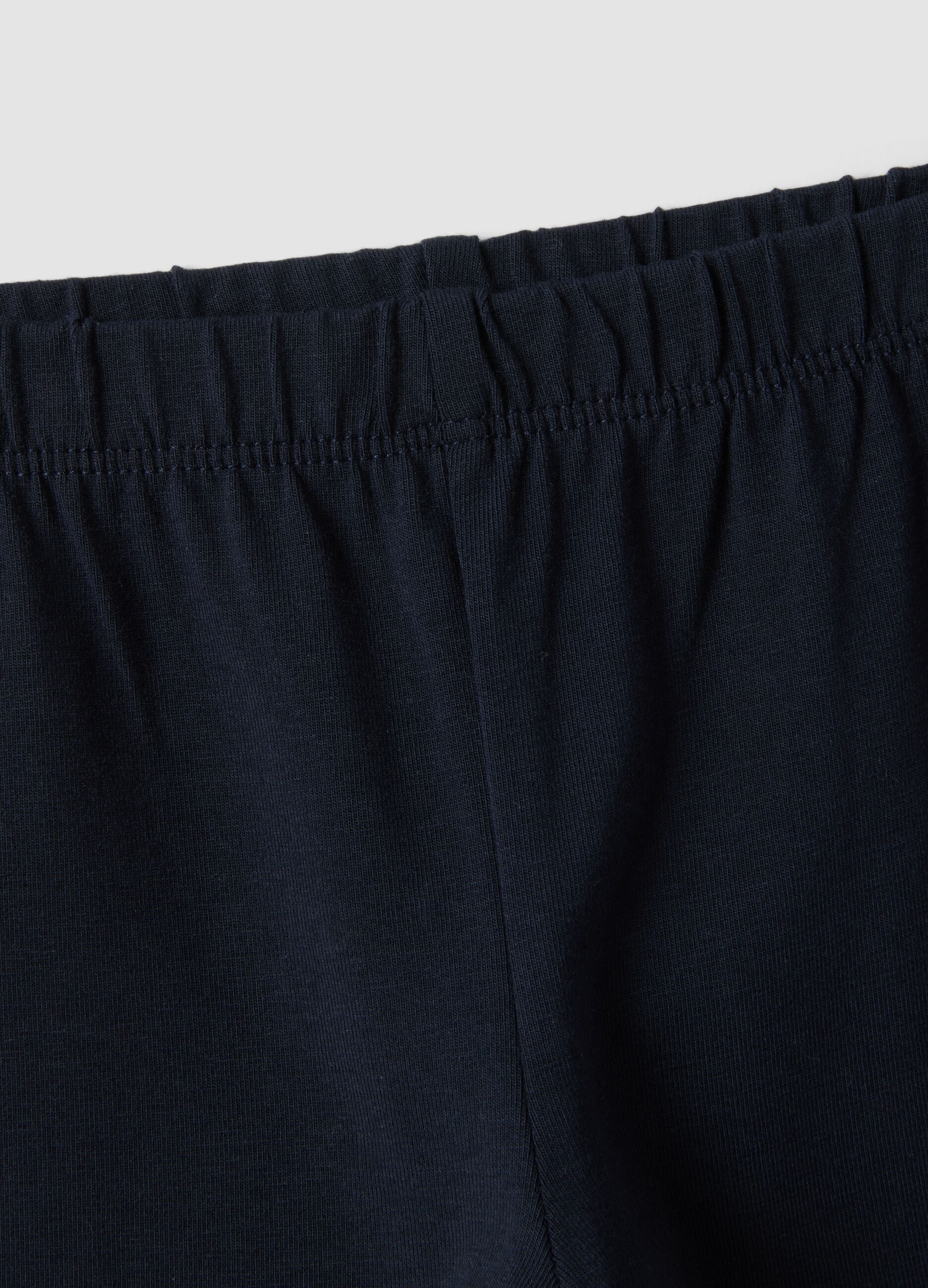 Blue flared leggings in stretchy organic cotton with heart detail for baby girl
