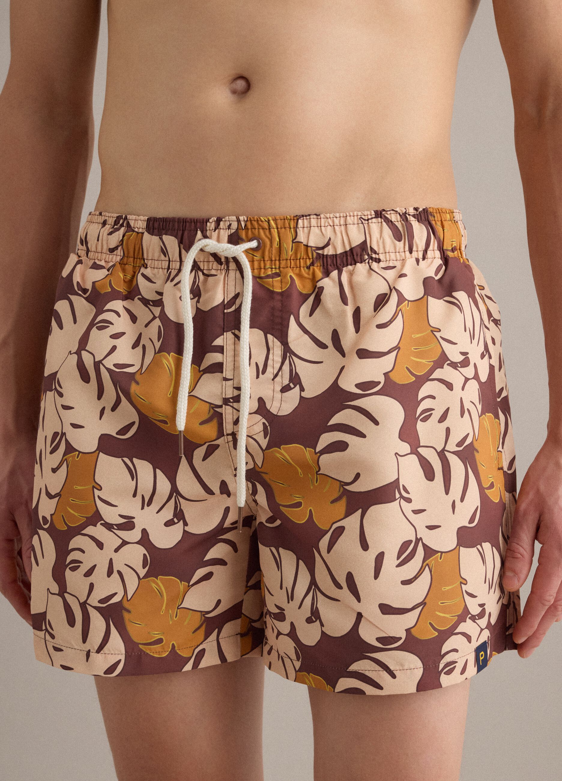 Brown tropical-print swim shorts