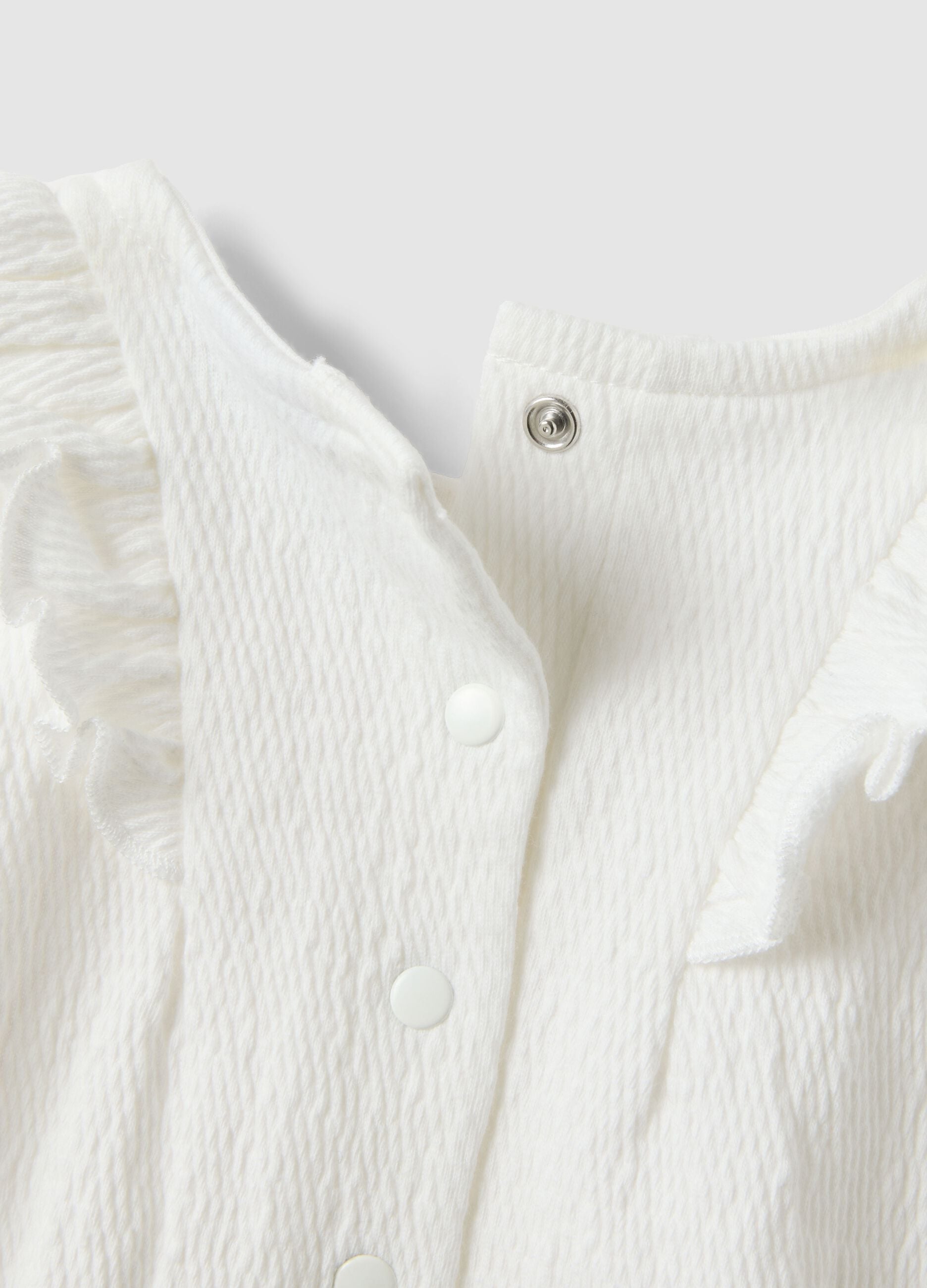 White baby body with ruffles in organic cotton blend