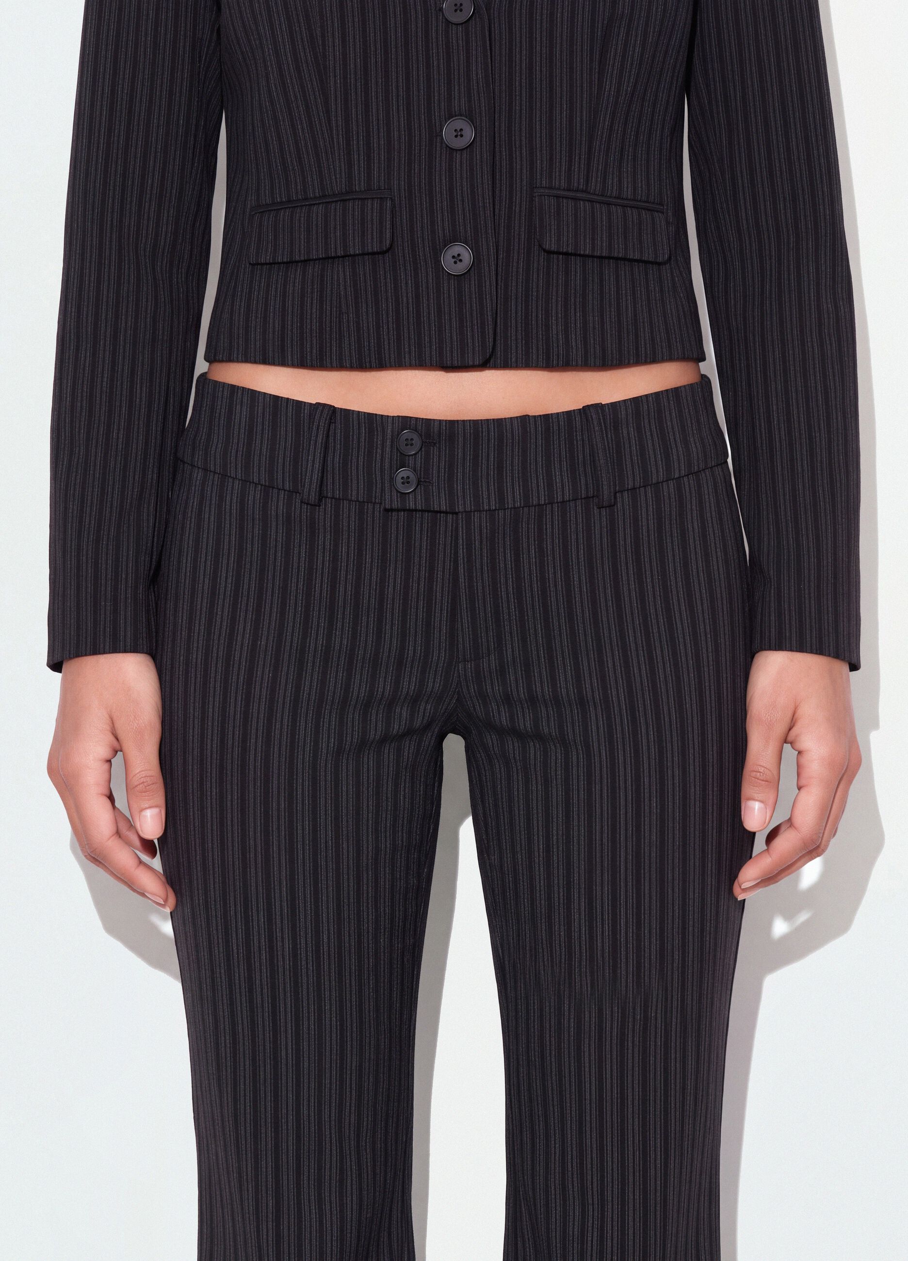 Black flared pinstripe trousers in stretch viscose