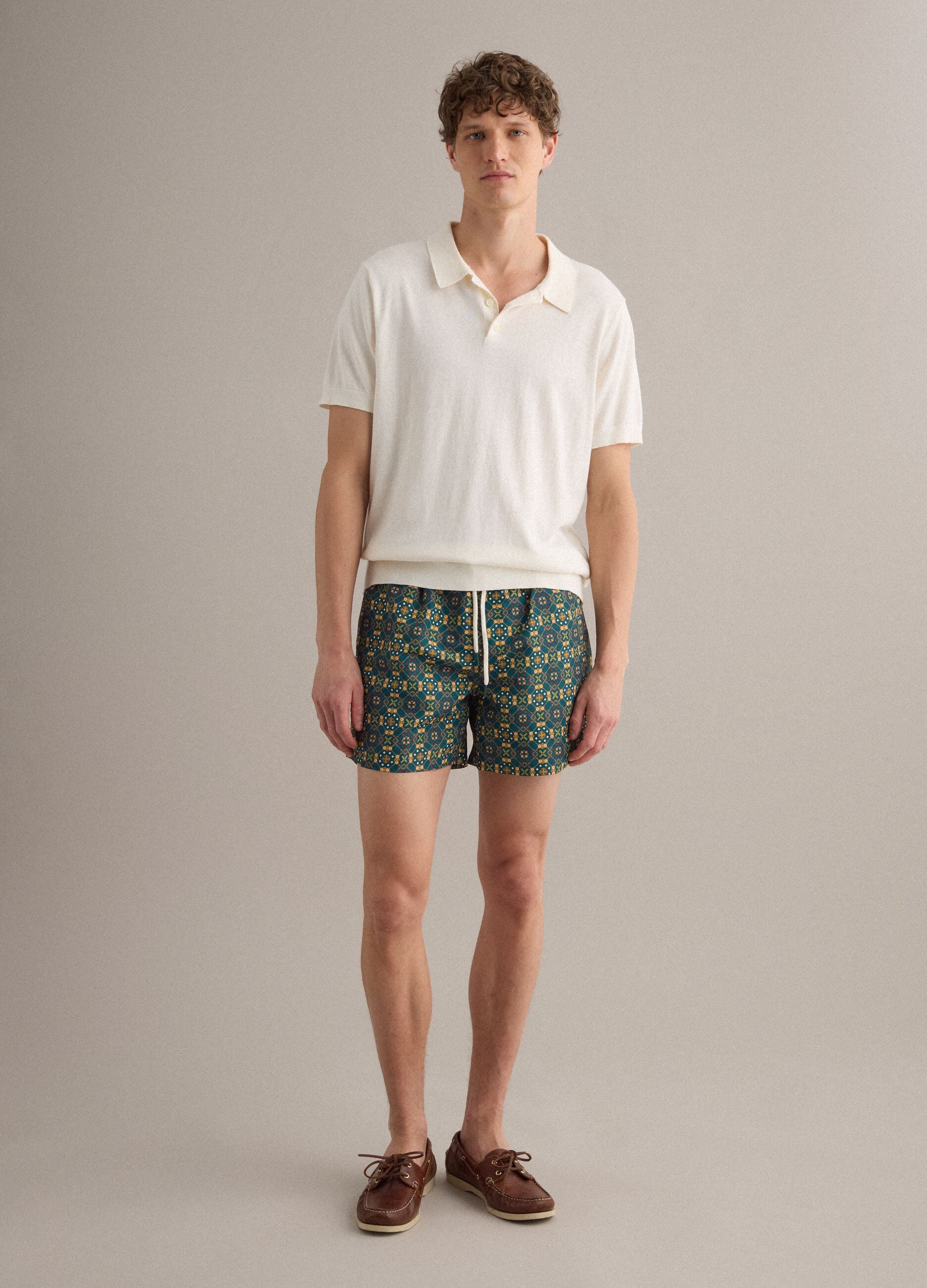 Green patterned swim shorts with elasticated waist
