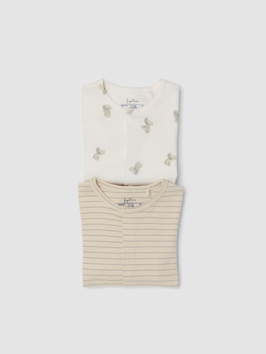 2-pack of organic cotton baby sleepsuits with feet in beige and white_2