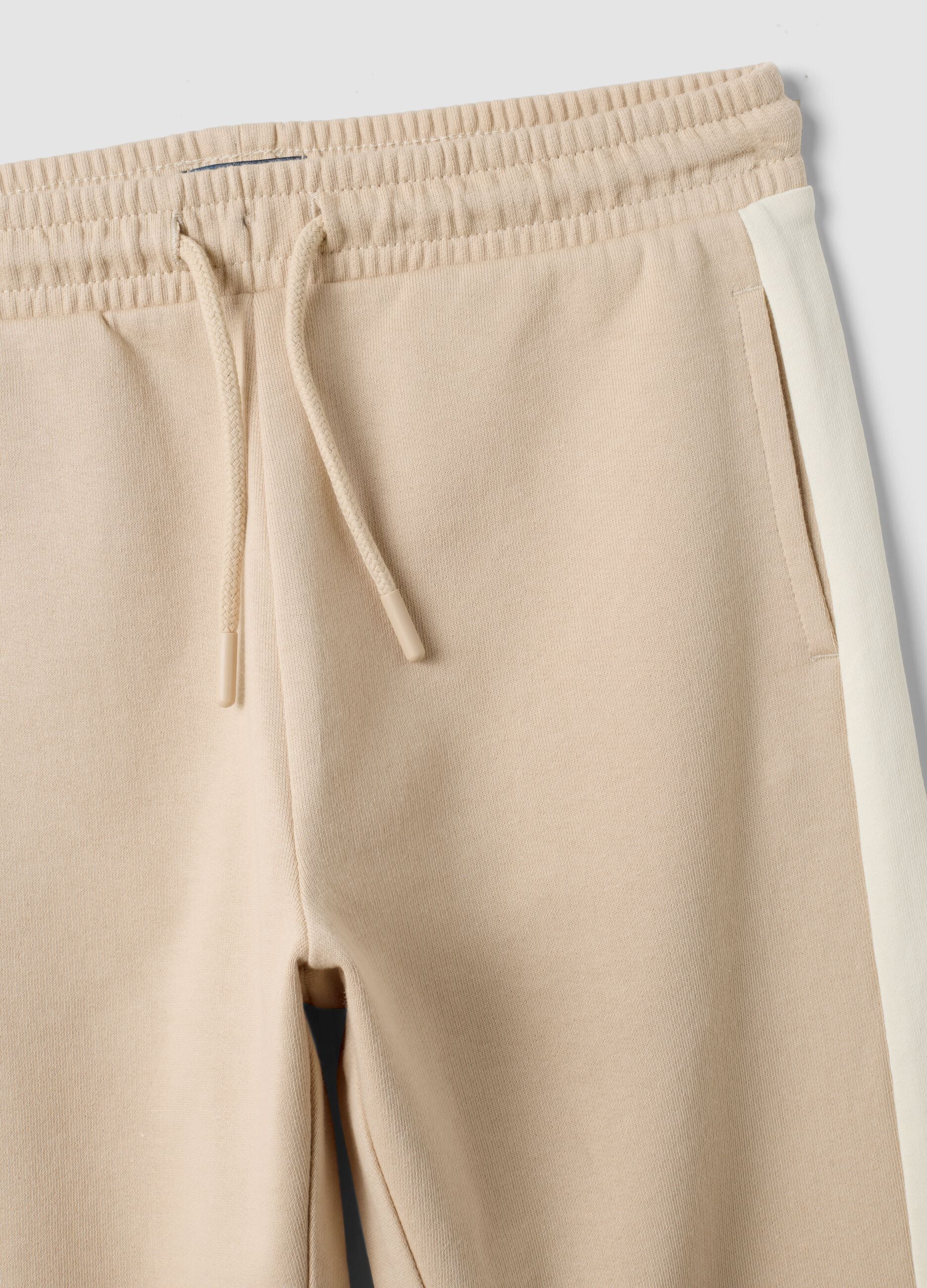 Beige pure cotton jogger trousers with side stripes for boys