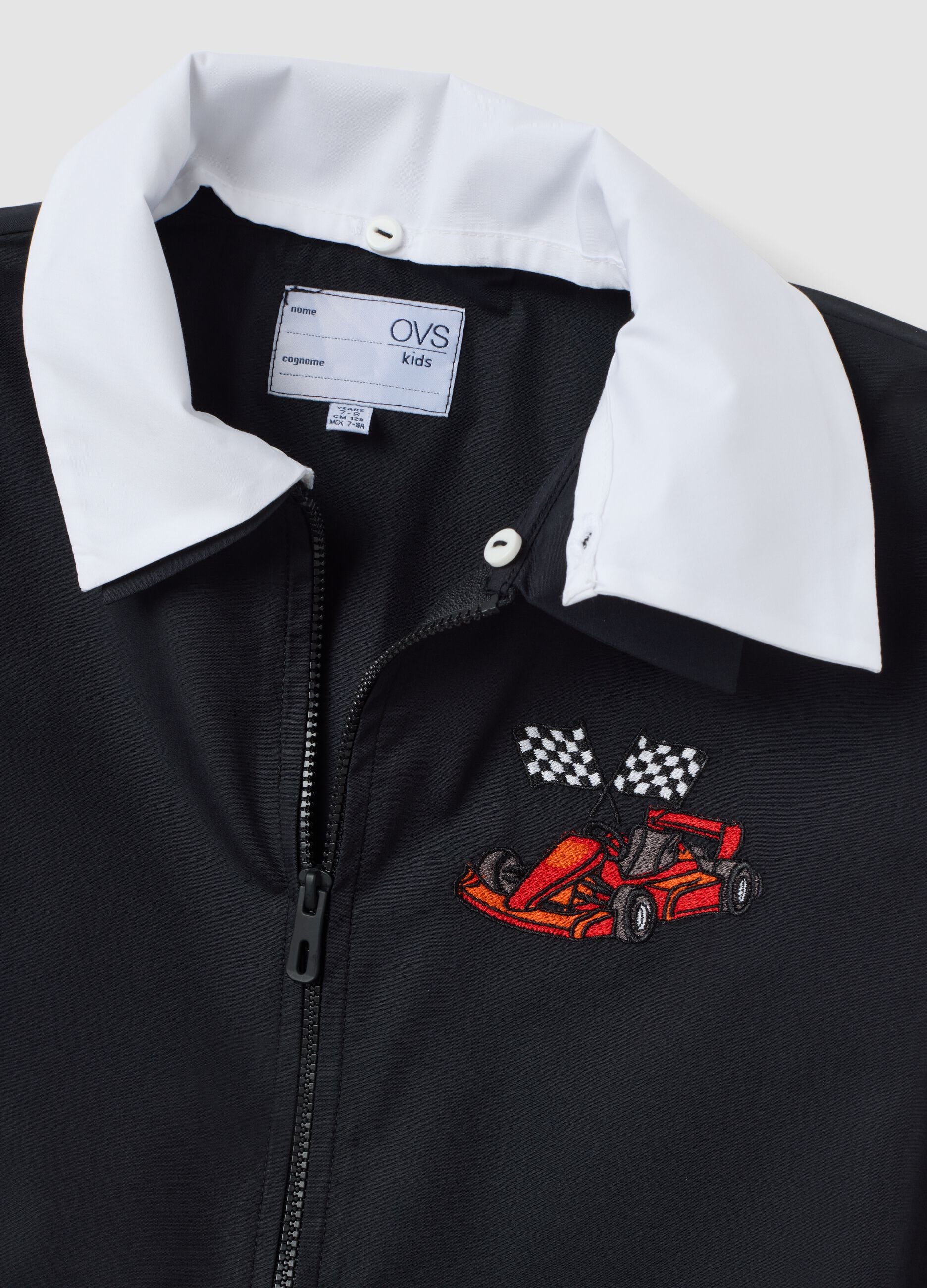 Customisable black school apron with zip and kart embroidery for boys