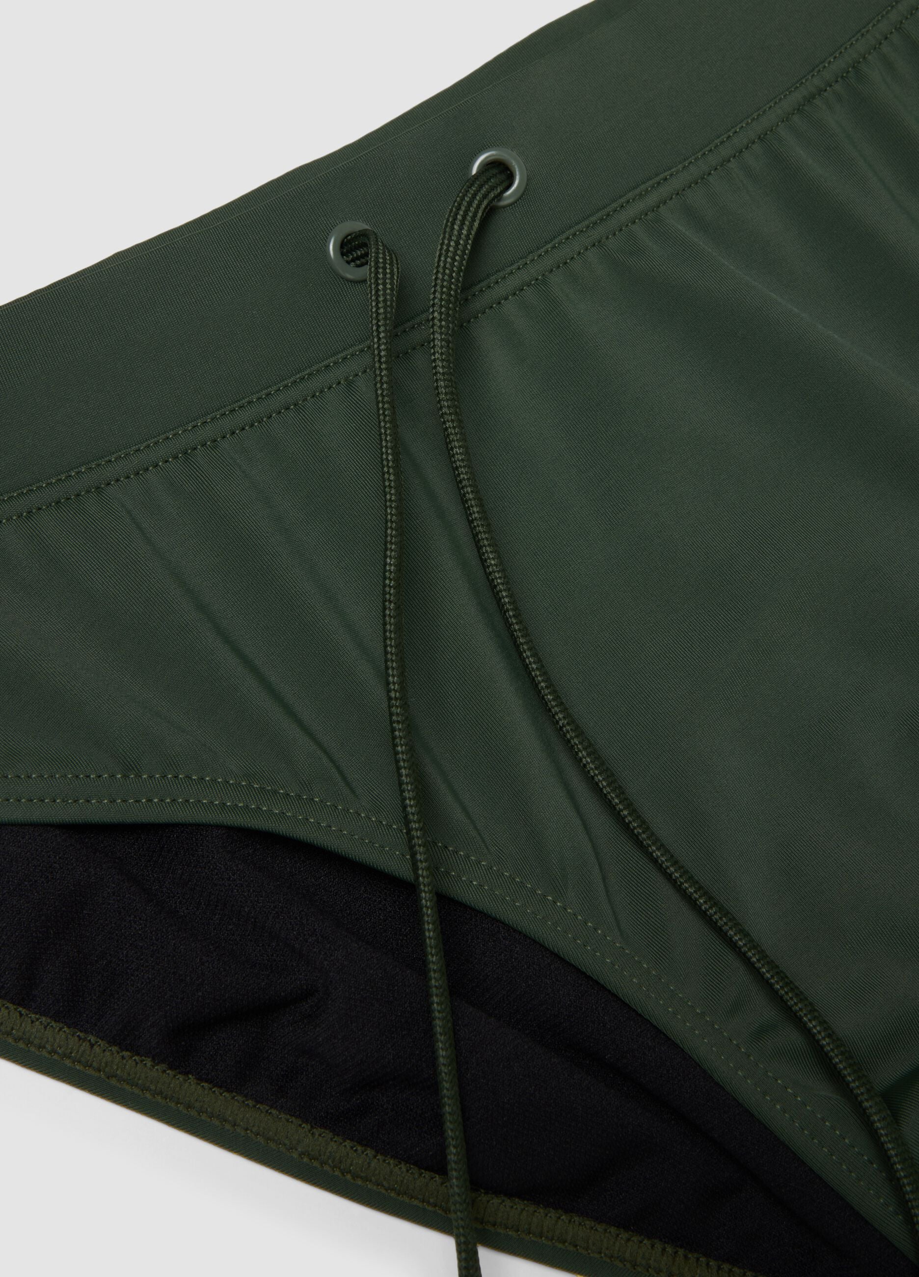 Green stretch fabric swim briefs