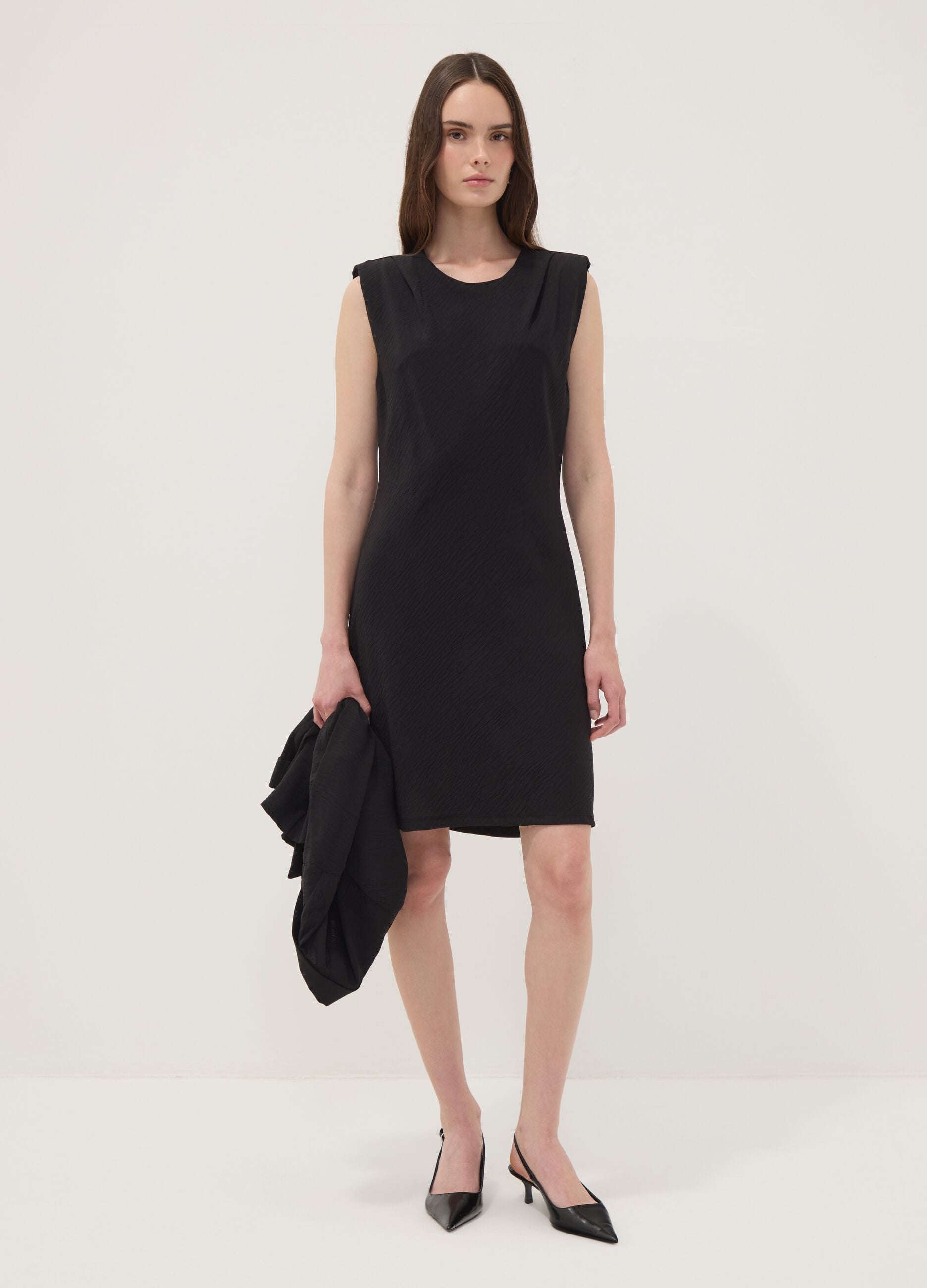 Black fitted dress with ruched detailing