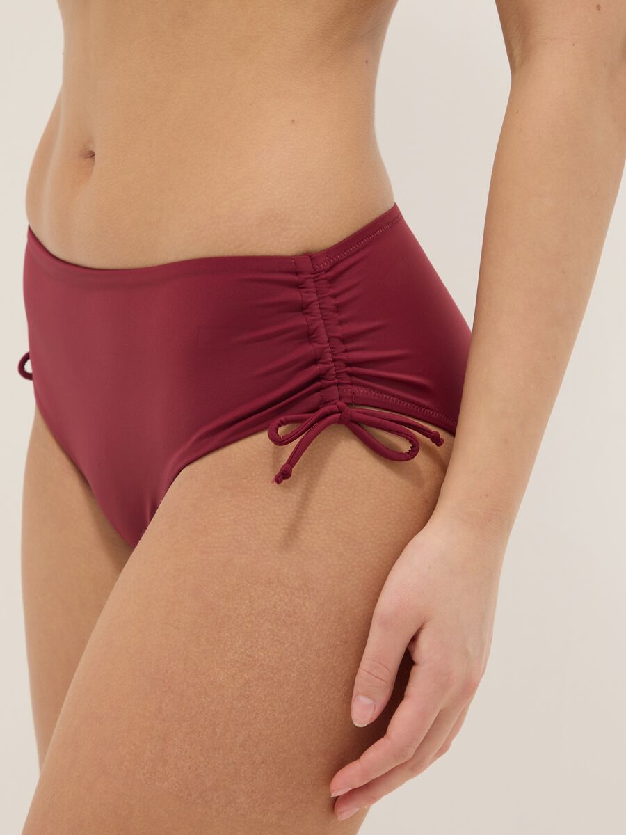 Red stretch bikini bottoms with ruched side detailing_3