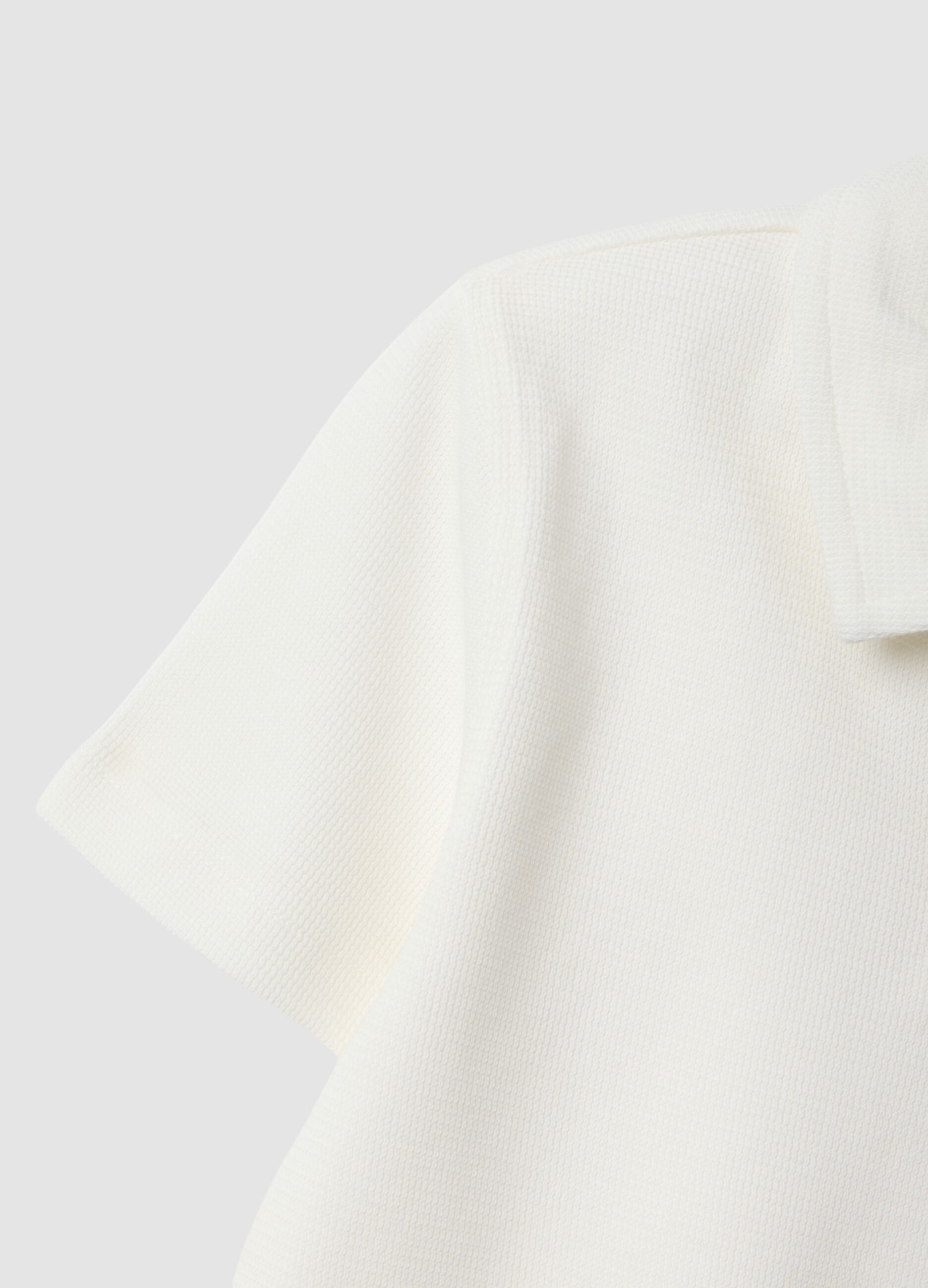 Polo bianca in cotone elasticizzato per bambino