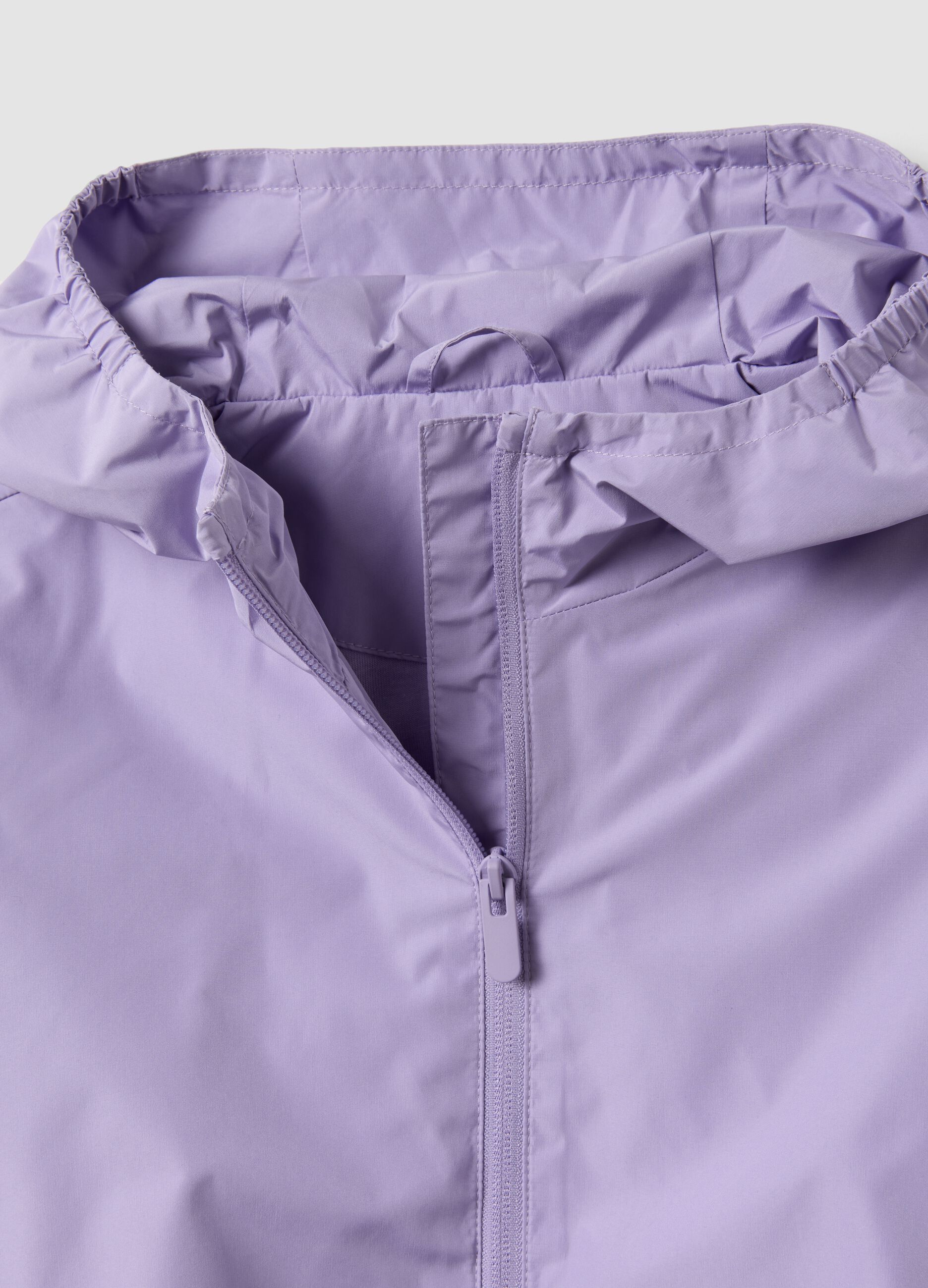 Purple rain jacket with hood and zip for girls