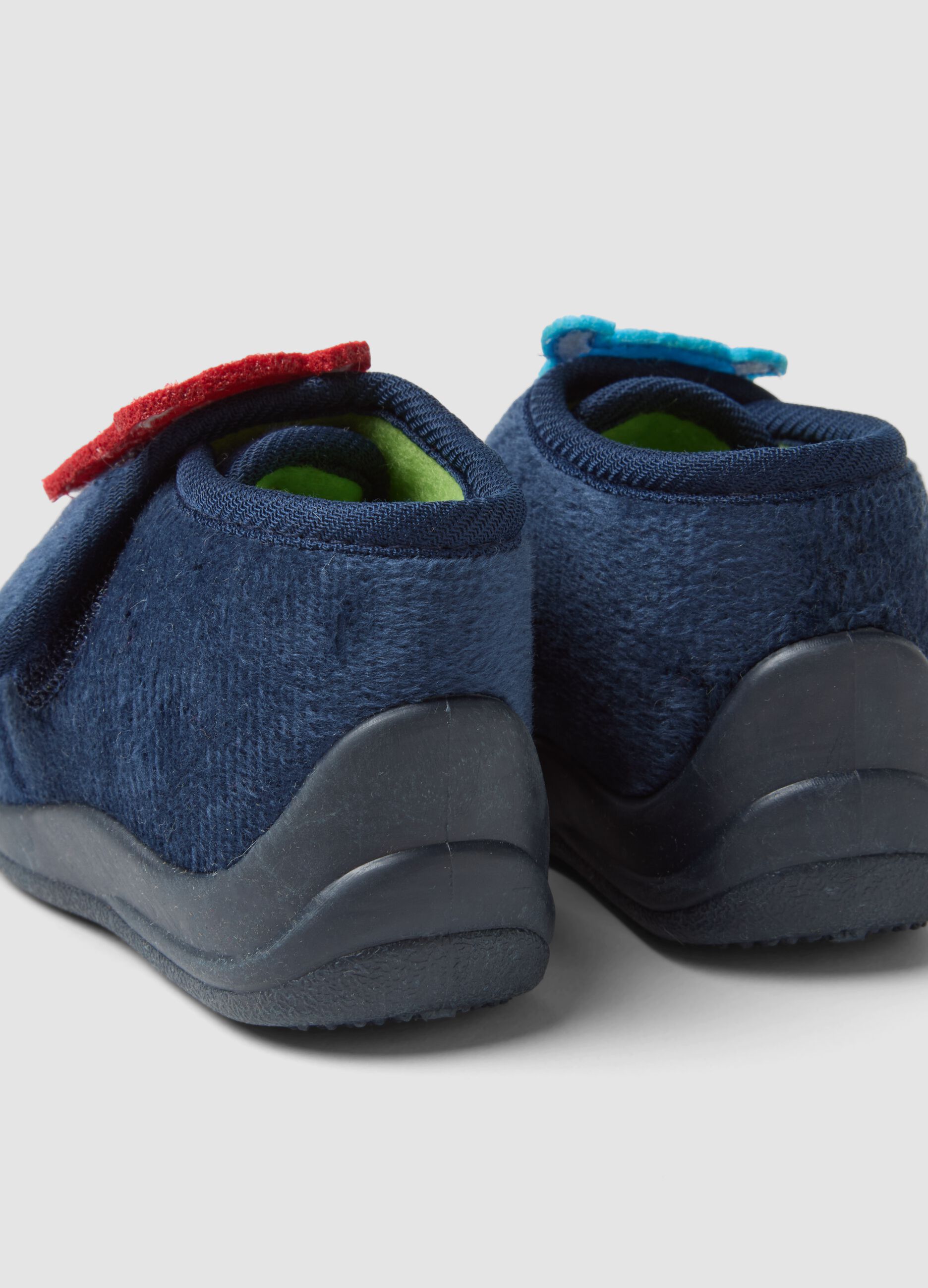 Blue slippers with embroidered monsters