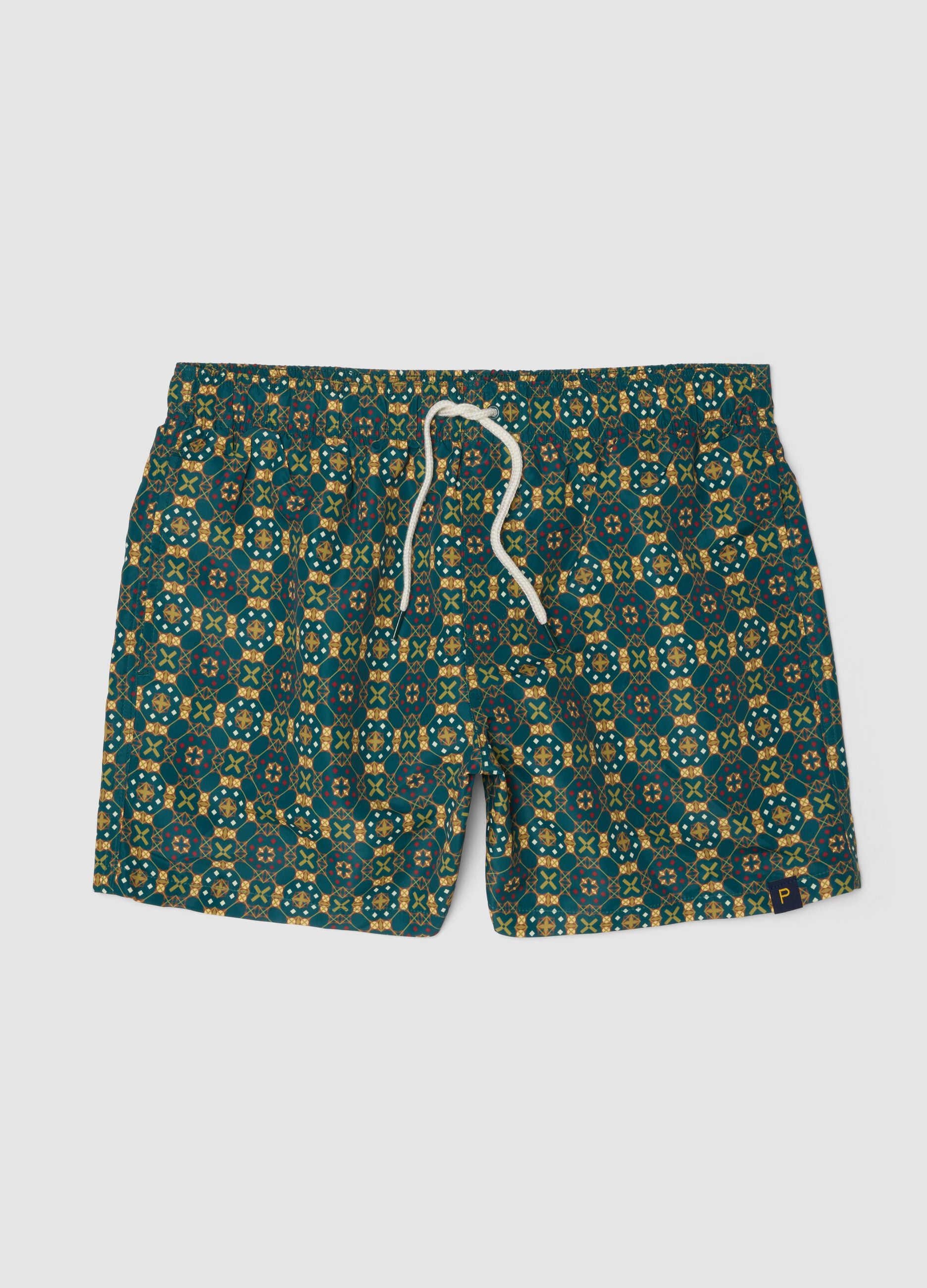 Green patterned swim shorts with elasticated waist