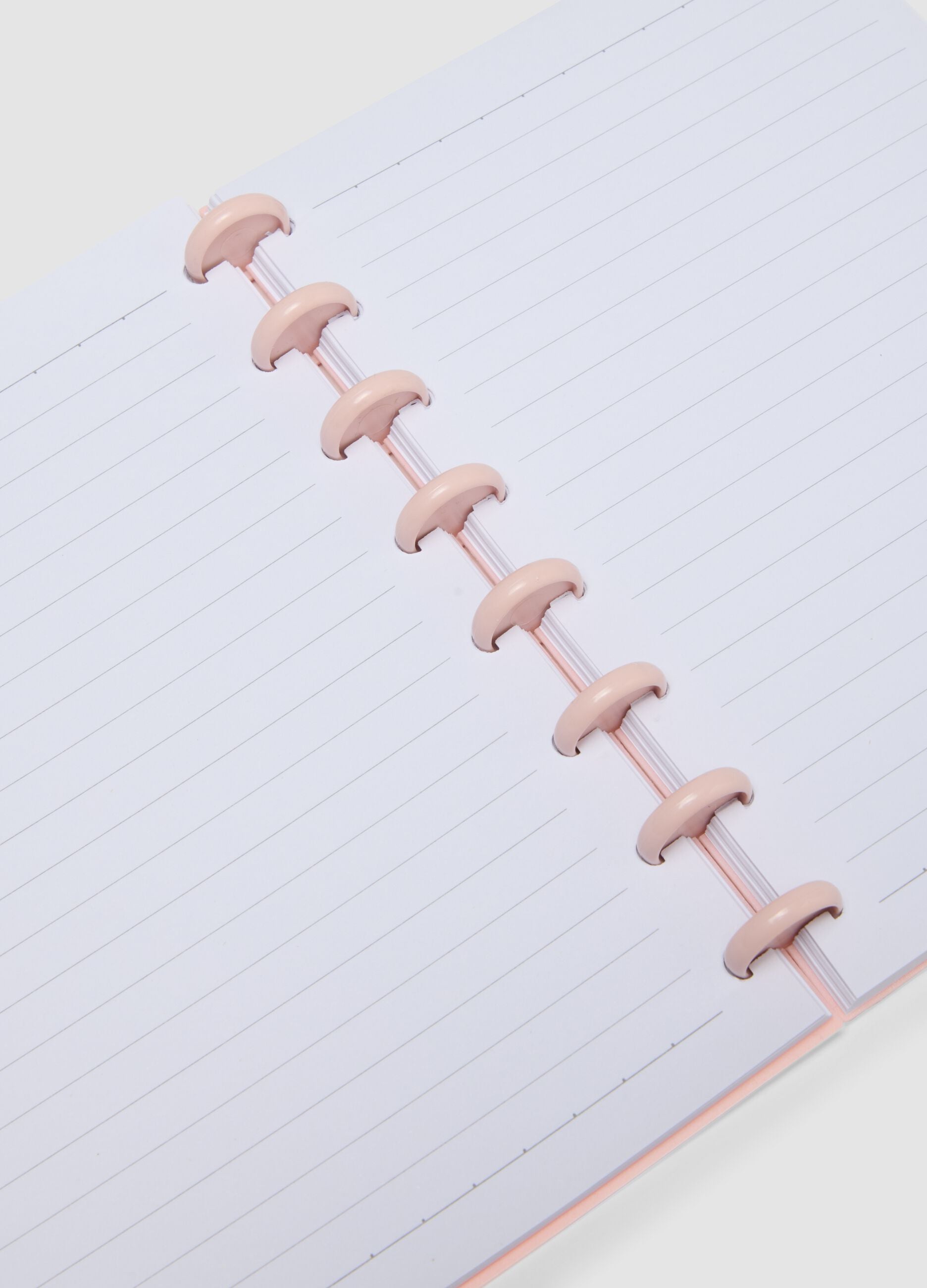 Pink notebook with lined pages in hardback with spiral