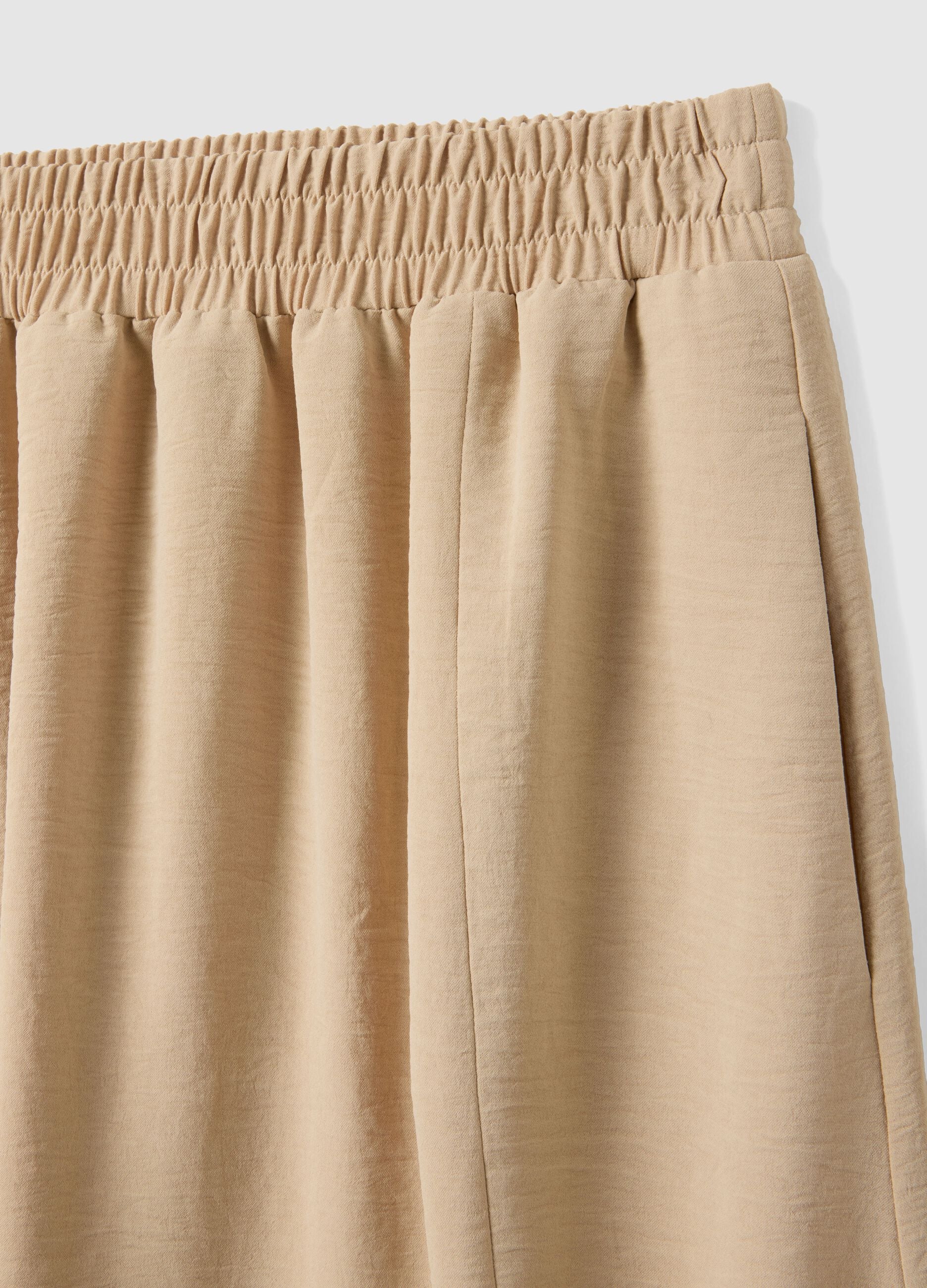 Beige long skirt, regular fit with elasticated waist and slit