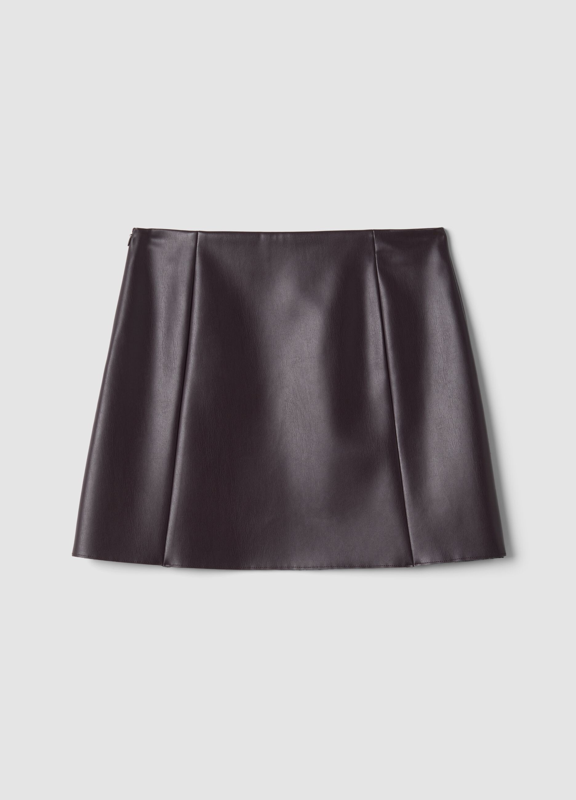 Short purple A-line skirt with decorative flap details
