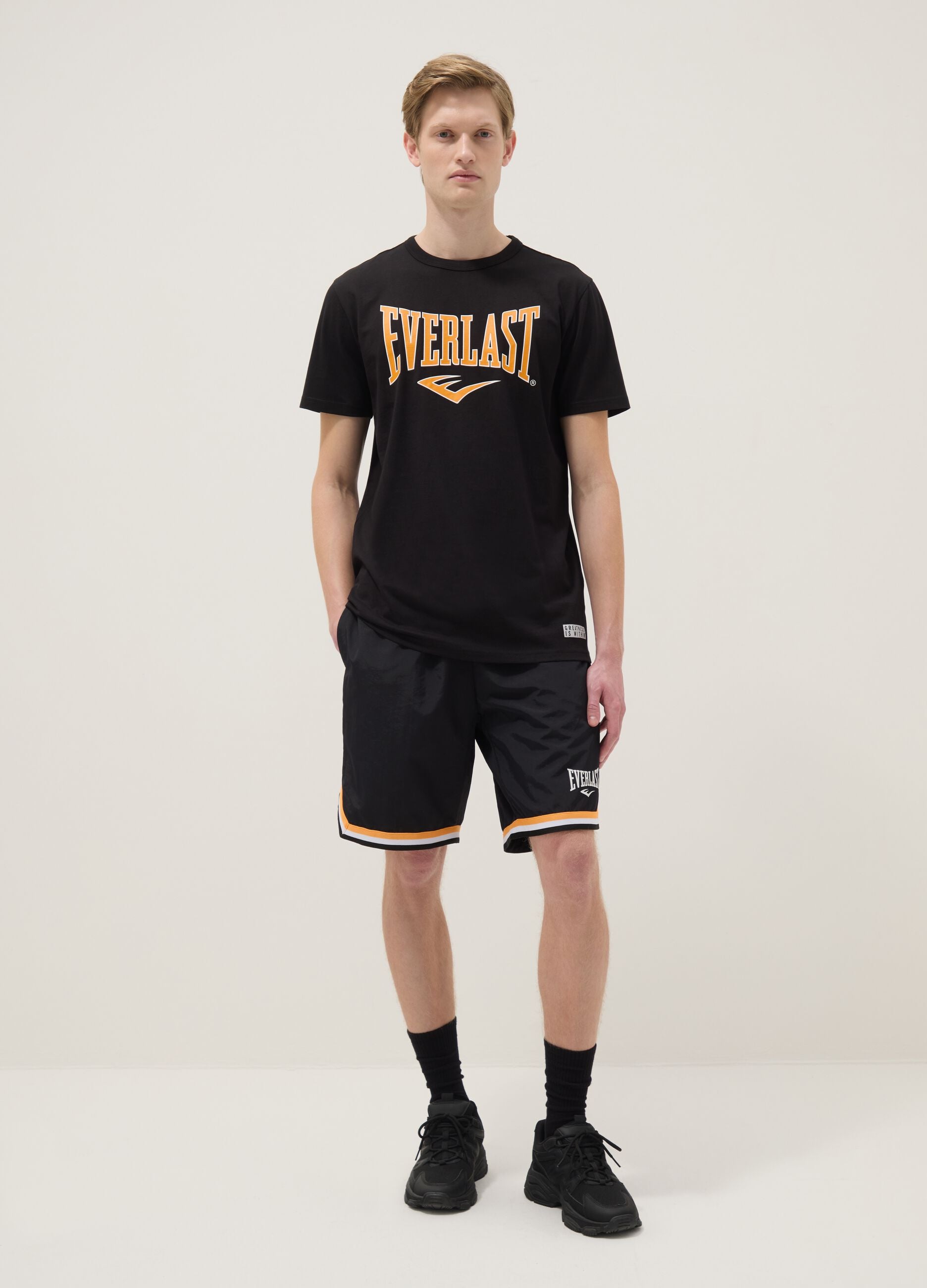 Regular fit black sports shorts with white and orange details