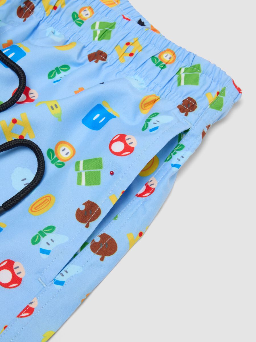 Blue swim shorts with Super Mario prints_5