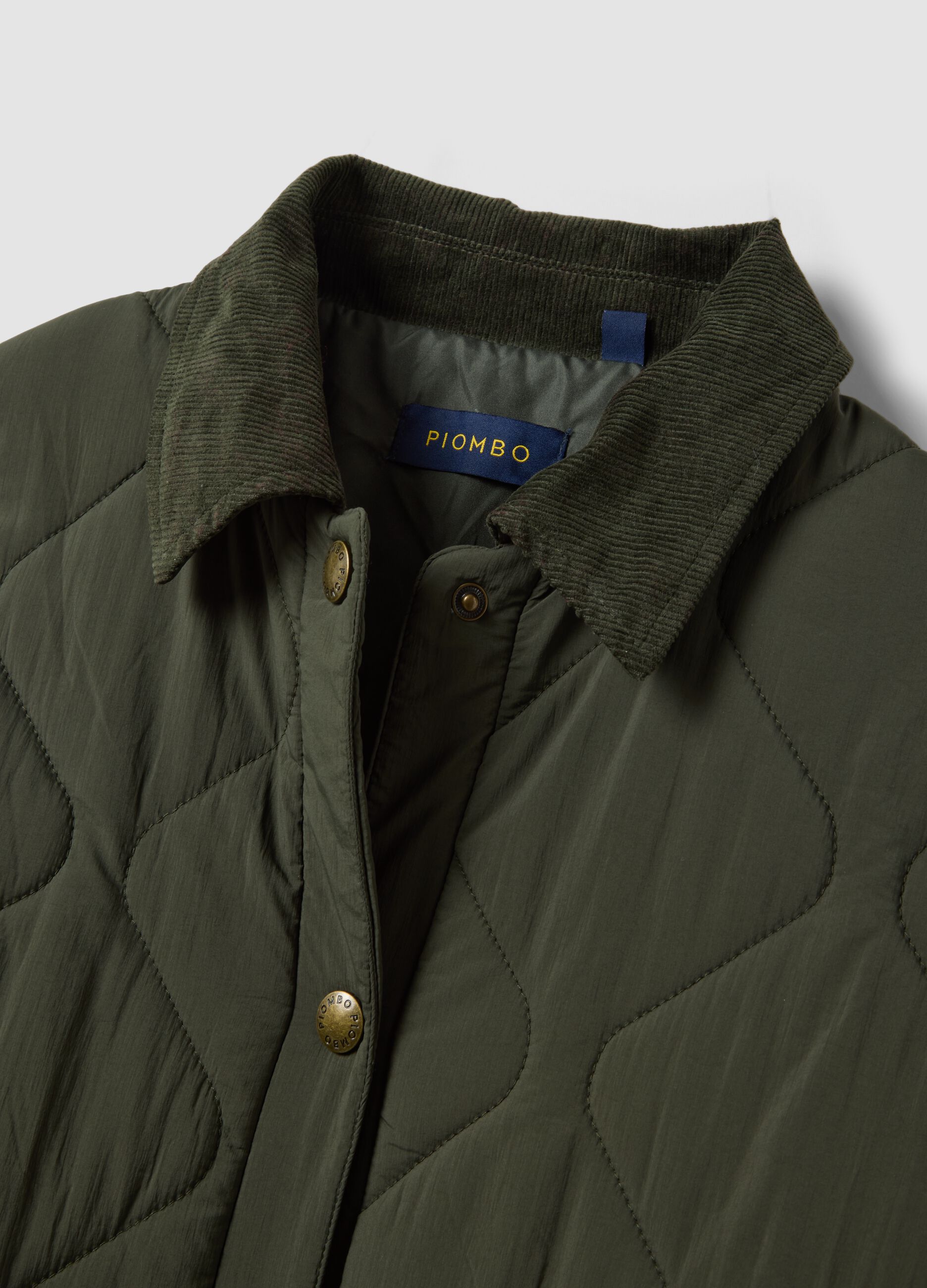 Green quilted padded jacket with buttons