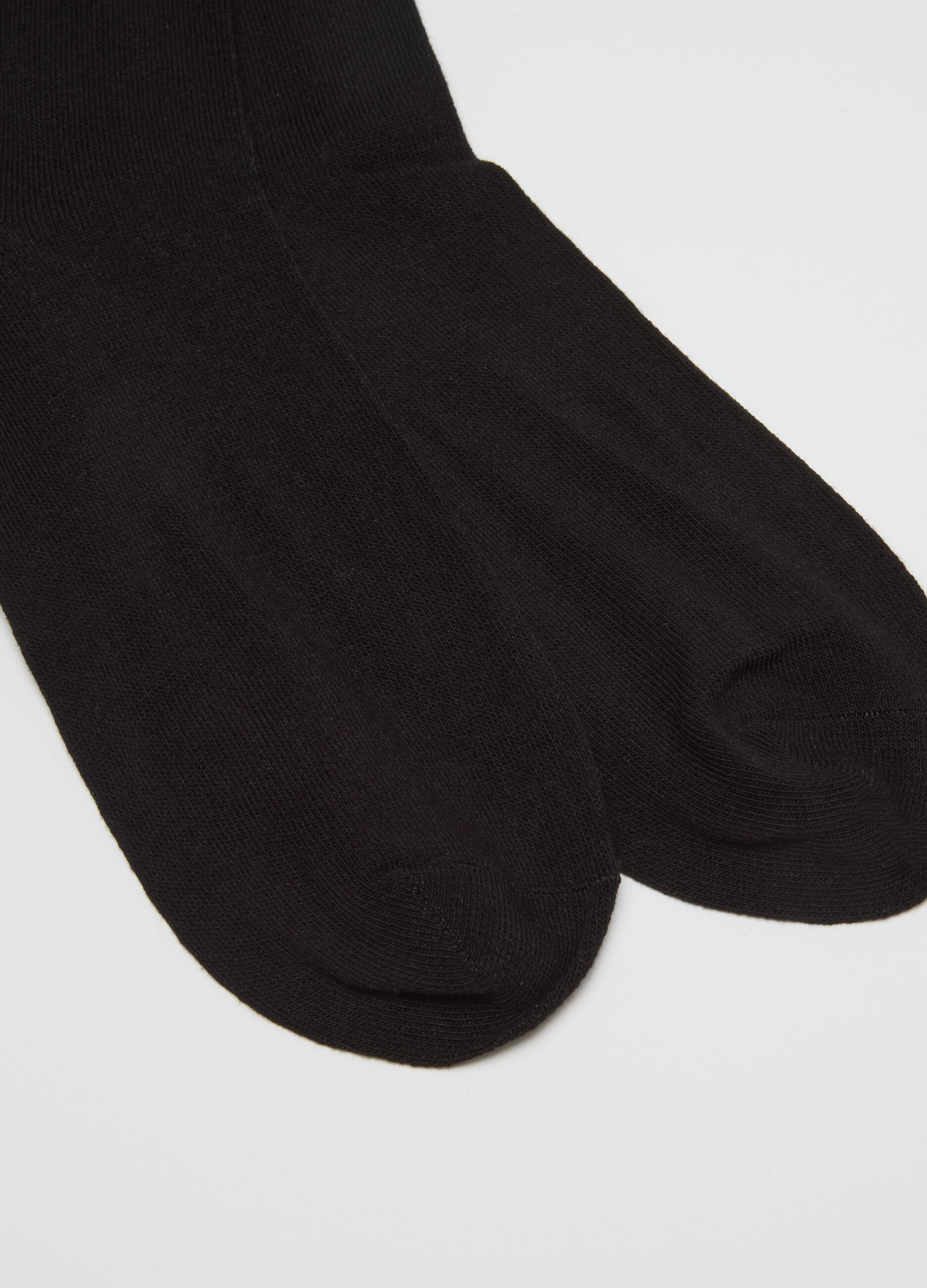 Multipack of long black socks in elasticated cotton blend