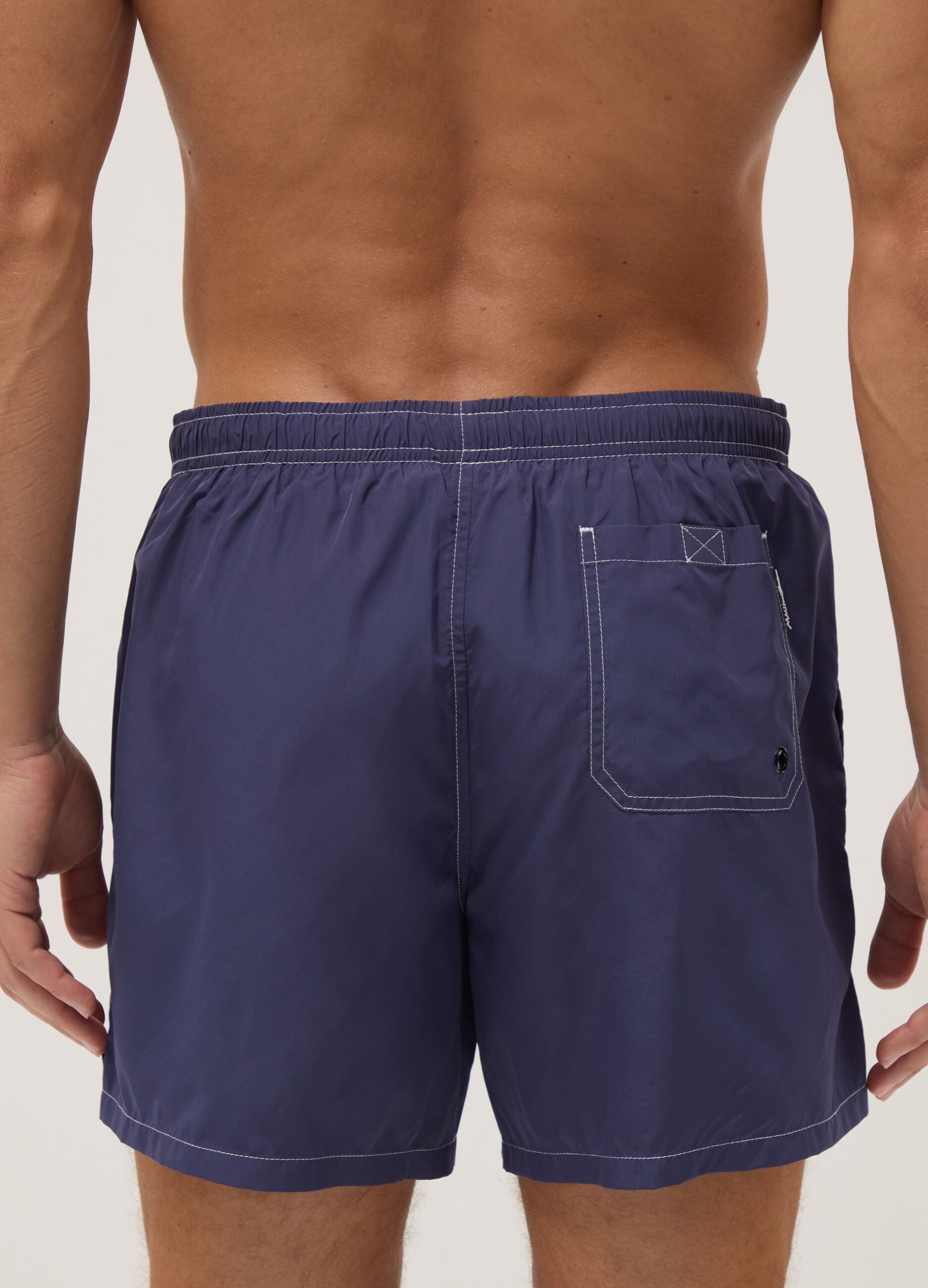 Blue swim shorts with drawstring waist